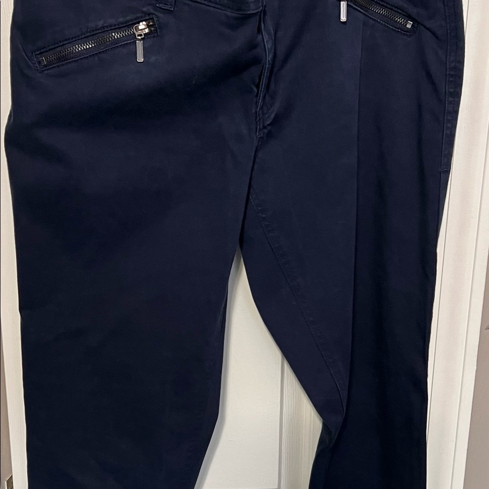Blue pants with zippered pockets with spandex